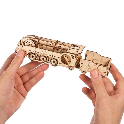 Mini Locomotive 3D Puzzle For Adults Hands On Wooden Train Model Kit Rubber Band Powered Mechanical Puzzle With 172 Pieces Easy DIY Craft Project For Home Workshop And Train Enthusiasts Pure Fun, held in hands