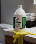Industrial Strength 45 Percent Pure Vinegar Concentrate for Heavy Duty Cleaning and Degreasing, 1 gallon bottle on counter.