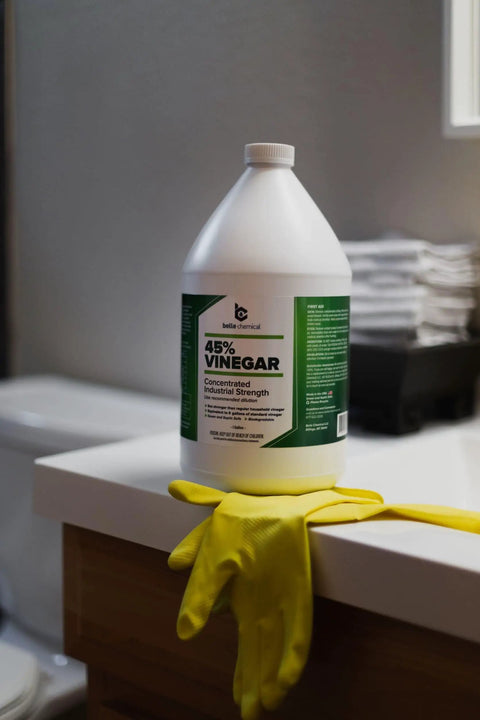 Industrial Strength 45 Percent Pure Vinegar Concentrate for Heavy Duty Cleaning and Degreasing, 1 gallon bottle on counter.