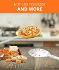 8 Inch Pizza Turning Peel With Long Handle Spinner, Perforated Aluminum Pizza Peel holding a pizza above bread basket