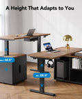 L Shaped Standing Desk With Electric Height Adjustment And Drawers 55 Inch By 23.6 Inch Walnut One Piece Desk Surface Four Memory Presets For Your Dope Home Office Setup And Computer Workstation shown, highlighting height adjustability from 28.3 to 46.5 inches with laptops and lamp on desk surfaces.