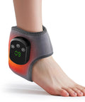 Person wearing wireless ankle heating pad for pain relief and neuropathy, grey wrap with digital display showing heat level on foot