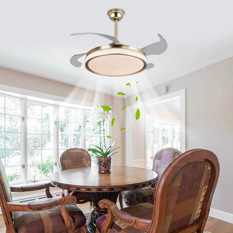 Semokia Ceiling Fan Light with Remote Gold Fan for Bedroom Living Room installed in a dining area with a round wooden table.