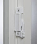 Close-up of latch on Vinyl Basement Slider Window 32 By 22 Inch White With Easy Glide Sash And Heavy Duty Frame For New Construction.