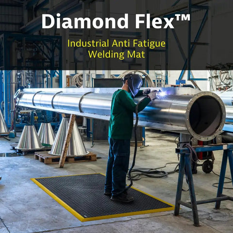 Worker using Diamond Flex Fire Retardant Rubber Anti Fatigue Mat For Welding Workstations Heavy Duty 40 By 64 Inch Industrial Floor Mat