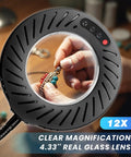 Hands using 12X Magnifying Glass With Light And Stand For Crafting, showing detailed beadwork through 4.33 inch lens.