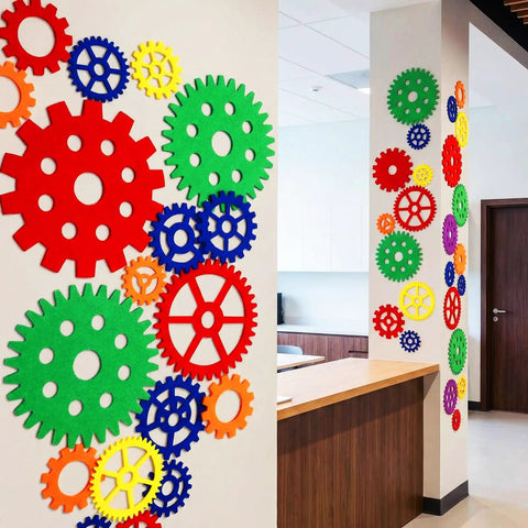 Decorative wall with Colorful Gear Shaped Felt Decor Mats Set Of 48 In Four Sizes 3.1, 4.7, 6.2, 7.8 Inches for classroom and party decor.