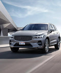 Volvo SUV on a highway with Volvo License Plate Frames 2 Pack Matte Black Aluminum Slim Edge Car Tag Frame.