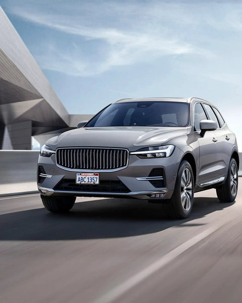Volvo SUV on a highway with Volvo License Plate Frames 2 Pack Matte Black Aluminum Slim Edge Car Tag Frame.