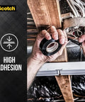Hands holding Vinyl 700 Electrical Tape Three Quarter Inch By Sixty Six Foot Black General Purpose Workhorse Tape for wiring.