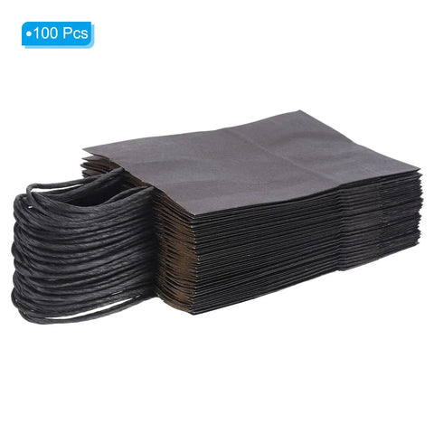 Black Paper Bags With Handles 5.9 By 3.1 By 8.2 Inches Pack Of 100 Tote Favor Bags stacked with handles on side.