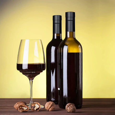 100 Pack Black Wine Bottle Sealers With Solid Airtight Plastic Cork Tops And Quick Squeeze Grip Caps on wine bottles with glass.