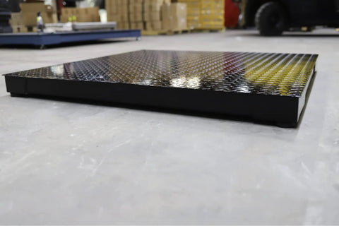 Heavy Duty Industrial Floor Scale 40 X 40 Inch Platform Scale Holds Up To 5000 Pounds One Pound Resolution viewed from side on warehouse floor.