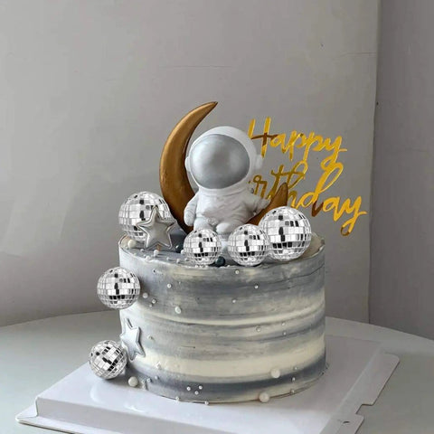 Cake with silver disco balls and astronaut, using 27 Piece Disco Ball Cake Toppers Set With Retro Turntable Dancers And Four Size Options