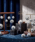 Must Have 50 Piece Silver Mirror Disco Ball Decor Set With Hanging Rings in Mixed Sizes on display blocks for decor