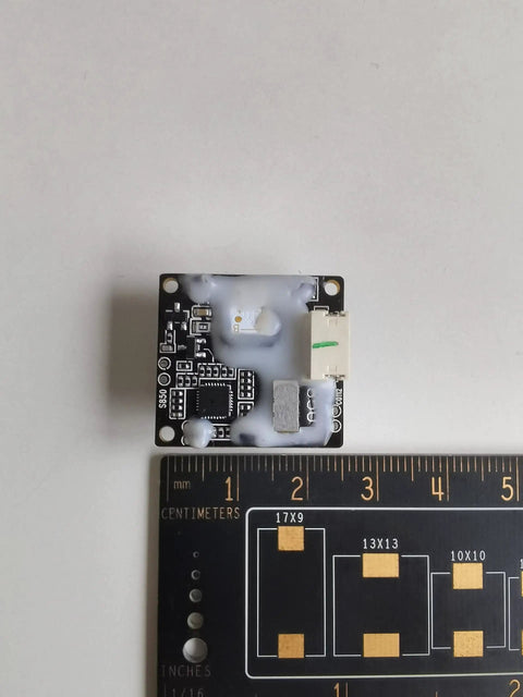 Solid State Lidar Sensor With 100 Degree Field Of View And Dual Wavelength 808Nm And 850Nm for robot scanning next to ruler for size reference