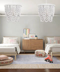 Two Tier White Wood Beaded Chandelier With Draped Maple Beads In Soft Painted White Finish in a boho bedroom setting