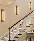 LuminaBrass Alabaster Wall Sconce, Solid Brass Home Indoor Wall Lighting illuminating staircase with soft light.