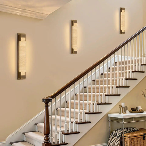 LuminaBrass Alabaster Wall Sconce, Solid Brass Home Indoor Wall Lighting illuminating staircase with soft light.