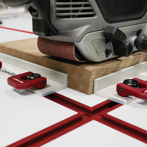 Dead Simple Quick Swap Cam Stops For Router Tables With Tight Grip T Track Clamps Low Profile Anodized Aluminum Body in use with wood.