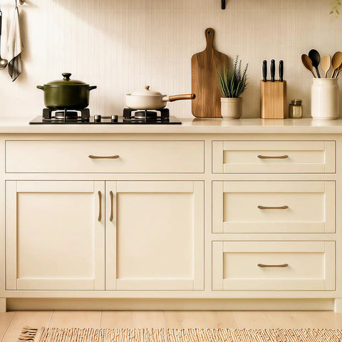 10 Pack Antique Brass Cabinet Pulls with Ergonomic Curved Grip for 5 Inch Kitchen Cabinets on cream drawers