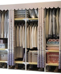 Heavy Duty Portable Hanging Closet Wardrobe With Rock Solid Steel Pipe Frame Designed For No Sweat Assembly And Roomy Clothing Storage For Tiny Rooms Or College Dorms with clothes organized inside.