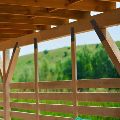 Built Like A Tank Heavy Duty I Shape Post To Beam Connectors Four Pack 10 By 3 Inch Mending Plates attached to a wooden frame.