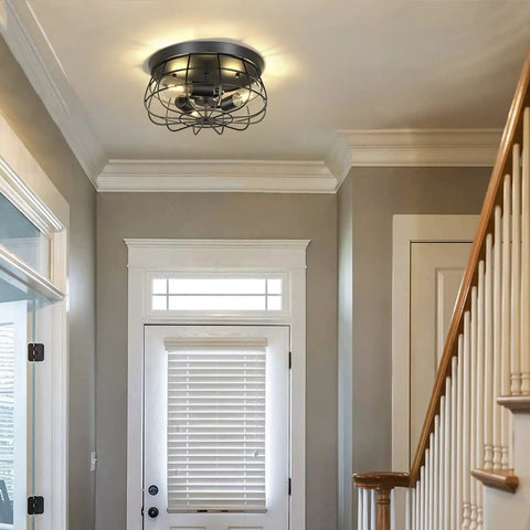 Farmhouse Flush Mount Ceiling Light Fixture With 3 Black Industrial Cage Lamps in a hallway setting