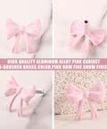 Pink Bow Dresser Knob Set With 30 Knobs And 90 Screws, 1.57 Inch Aluminum Alloy Handles for drawers and cabinets, front view.