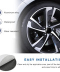 4 Piece Wheel Hub Center Cap Decals Sporting A Slick Usa Flag Graphic And Glossy Black Vinyl For Your Ride No Fuss Peel Stick Install Heavy Duty Weatherproof at an angle on a polished wheel.