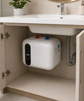 2.6 Gallon Electric Mini Tank Water Heater Equipped With Solid Stainless Steel Core For Compact Under Sink Placement Quick Warm Water Relief In Kitchens Or Rvs Featuring No Sweat Setup And Plug And Play Wiring installed under a kitchen sink.