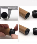 Six Pack Round Tube Plugs With M8 Thread Black Plastic Furniture Leg End Caps 30mm Diameter installation on wooden leg.