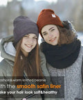 Two women wearing 3 Pack Satin Lined Winter Beanie Hats For Women And Men, Knit Beanies That Stay Warm, Soft Acrylic With Cozy Cuff.