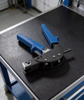 Hollow Wall Anchor Tool For Drywall And Plaster, Carbon Steel Hand Riveter With M5 Anchors, on a black workshop table