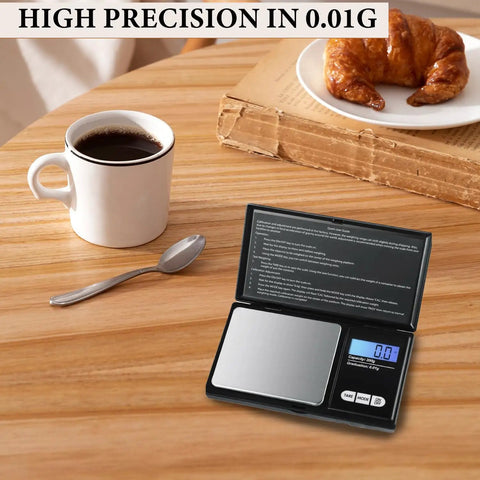 Dope Portable Digital Pocket Scale 0.01g Precision, 1000g Max, Backlit LCD Display on wooden table with coffee and croissant