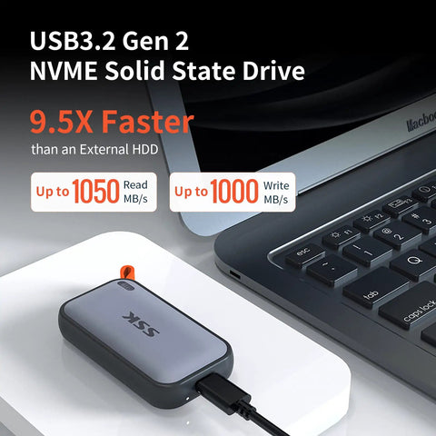 Portable 500GB External SSD With USB C Up To 1050 MBps USB 3.2 Gen2 next to laptop, showcasing speed and compatibility with devices.