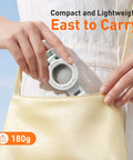 Person placing Phone Camera Grip With Selfie Stick Tripod Magnetic Mount And Detachable Wireless Shutter Button into a small handbag.