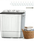 Compact Portable Washing Machine Featuring Heavy Duty Motor And Rapid Clean Cycle With Free Drying Rack Ten Sturdy Hangers Skips Laundromat Grind For Fresh Threads Daily next to a basket of towels.