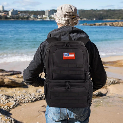 Man by the beach wearing Dual Deck Insulated Cooler Backpack For Men With 2 In 1 Bottom Cooler And Dry Top Compartment