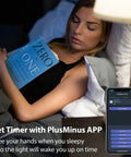 Woman sleeping with book, phone app showing Four Pack A19 Color Changing Smart Bulbs 800 Lumens 7.5W 60W Eq E26, No Hub Needed