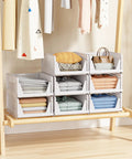 Five Pack Stackable Closet Storage Baskets Set Waterproof Foldable Organizer White filled with clothes and accessories