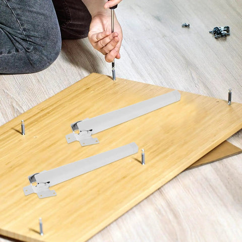 Installing Four Pack White Plastic Adjustable Furniture Legs With Built Tough Iron Frame on wood panel.