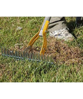 Thatch Rake For Lawns With Curved Steel Tines 15 Inch Brown All In One Lawn Care Tool in use on grass.