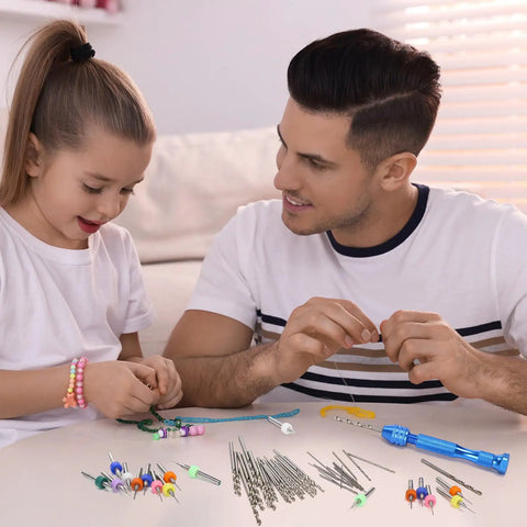 Father and daughter using 59 Piece Hand Drill Bit Set With Pin Vise And Tungsten Carbide Micro Bits for jewelry making