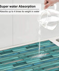 Water being poured on Ultra Absorbent Cyan Wood Grain Microfiber Dish Drying Mat For Kitchen Counter, Machine Washable 16x18 Inch.