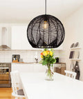 Small Black Rattan Pendant Light For Kitchen Island And Living Room Ceiling in a modern kitchen, boho wicker chandelier hanging above a table