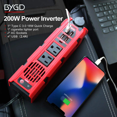 Tailgate Tough 200W Car Power Inverter Converts 12V Dc To 110V Ac No Hassle With Dual Us Sockets Super Fast 2 4 Amp Usb Ports And Type C For Weekend Warriors, red inverter with dual AC sockets and USB ports charging a phone.