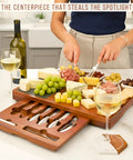 Personalized Acacia Wood Charcuterie Board Set With Heavy Duty Stainless Steel Knives - Custom Engraved Cheese Board Tray For Weddings Housewarmings Dope Hosting Essentials That Slays Every Hangout with assorted cheeses, fruits, and knives.