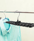 Set Of 2 Black Mens Belt And Tie Hangers To Keep Your Closet Swag On Point Multi Slot Hook Rack holding a blue shirt.