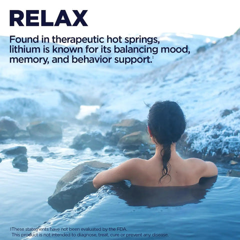 Person relaxing in hot spring with snowy mountains, promoting Lithium Orotate 5mg Chelated Supplement For Mood Support.